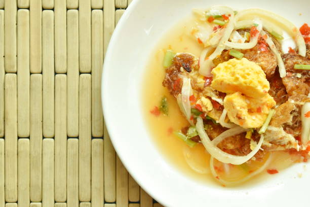 istock spicy fried egg cutting with onion Thai salad 1096976116