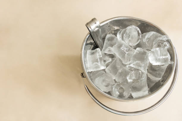 istock A silver bucket made from aluminum full filled with ice cube is placed on the table at the pub, ice were made for make water, whisky, vodka or alcohol drinking cold 1096979382