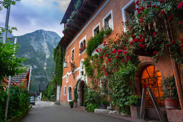 HALLSTATT, AUSTRIA - 20 JUNE 2014: Town square in Hallstatt, Austria. Hallstatt is historical village located in Austrian Alps at the Hallstatter lake and promoted by UNESCO World Heritage region.