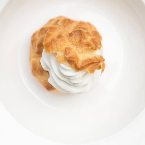 Top view of One Choux Cream in white plate stock photo
