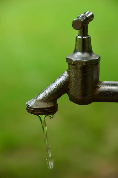 istock Outdoors faucet with flowing water 1096987262