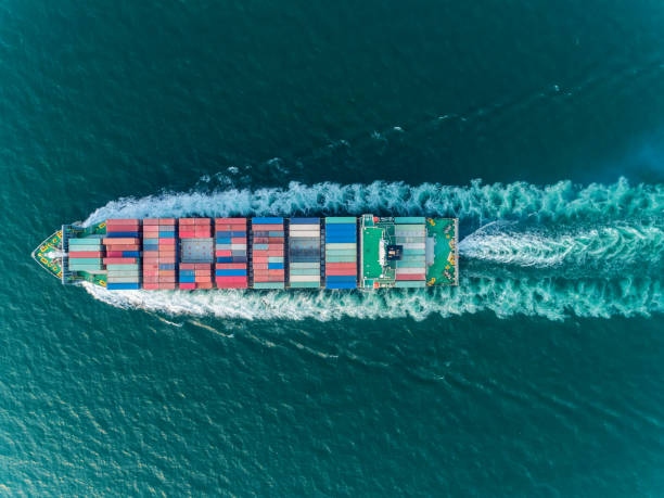 istock Aerial top view container ship full speed for logistics , import export, shipping or transportation. 1096989524