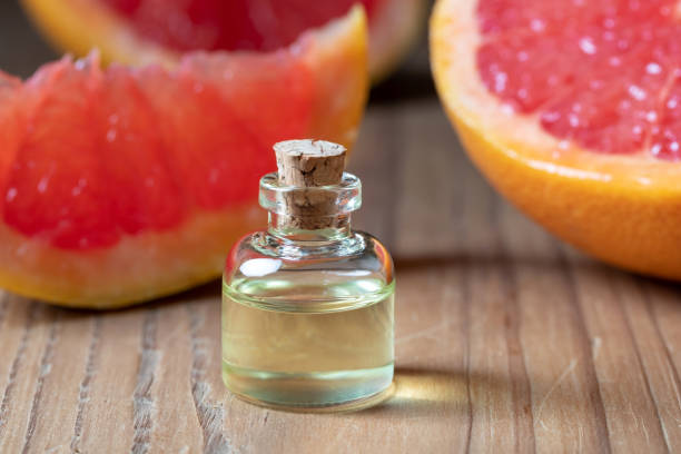 istock A bottle of grapefruit essential oil with fresh pink grapefruit 1096989760