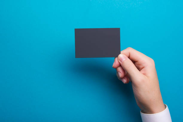 istock Hand holding white business card on white background 1096992152