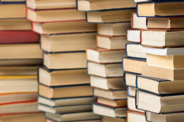 istock Open book, hardback books on wooden table. Back to school. Copy space. 1096993008