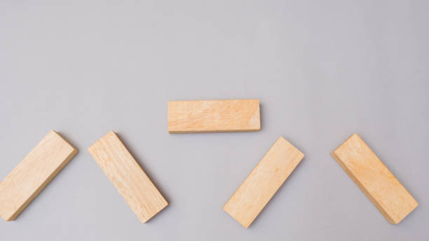 istock Wood block stacking arrow symbol.Business concept on gray background 1096995302