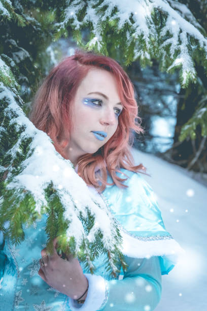 istock Attractive red haired woman in winter cape 1097004134