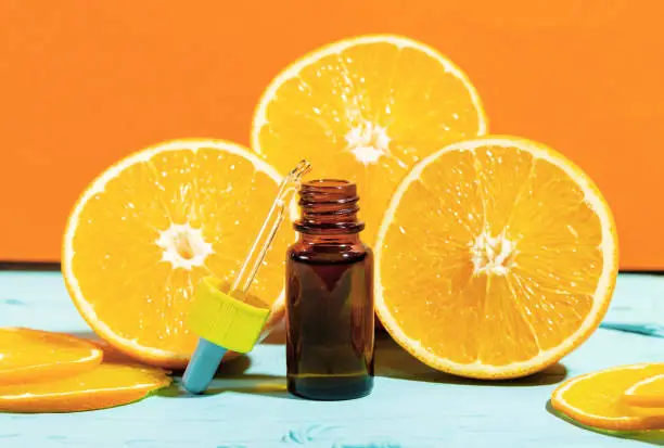 Bottle with essential oil orange