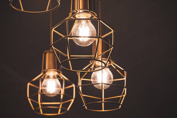 istock Chandelier with hanging bulb lamps 1097016202