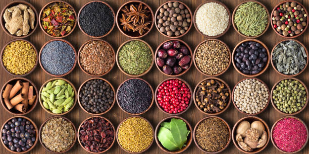 spices and herbs in cups. colorful seasonings wallpaper - ingredient fennel food dry imagens e fotografias de stock