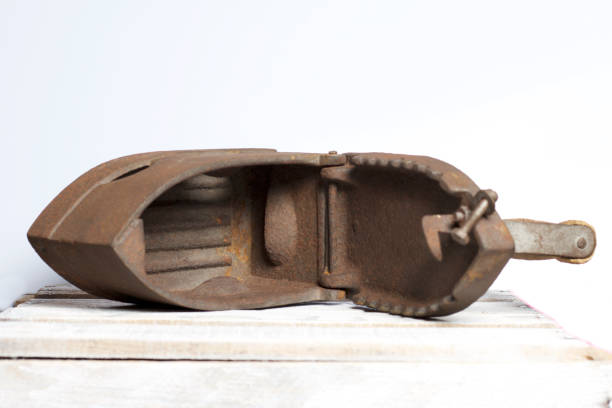 istock Old iron, heated by hot coals. Opened coal compartment. Located on the a wooden box. 1097019868