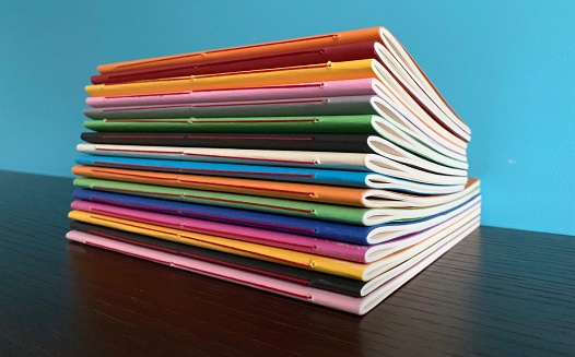 Row of colorful diaries