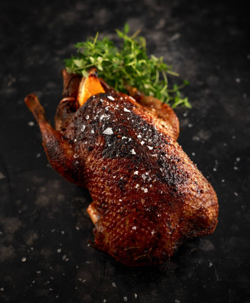 istock Grilled wild mallard ducks with orange and herbs. 1097039180