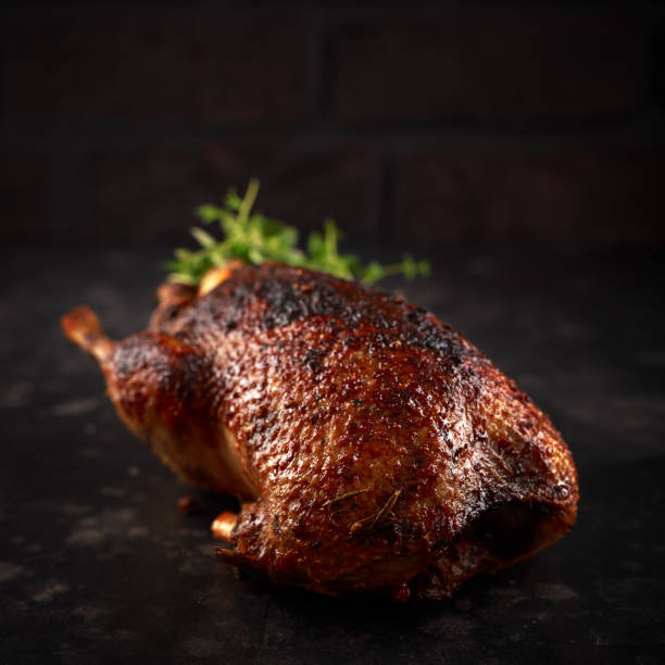 istock Grilled wild mallard ducks with orange and herbs. 1097039210