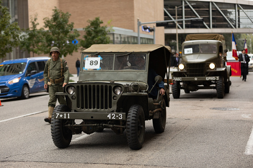 Houston, Texas, USA - November 11, 2018: The American Heroes Parade, A group of military Willys jeeps going down the street during the parade