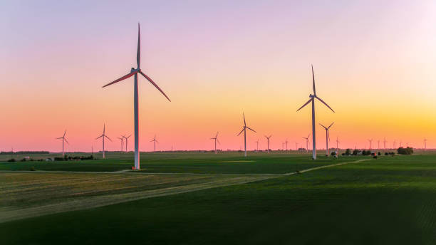 istock Windmills On Field Against Sky During Sunset 1097047088
