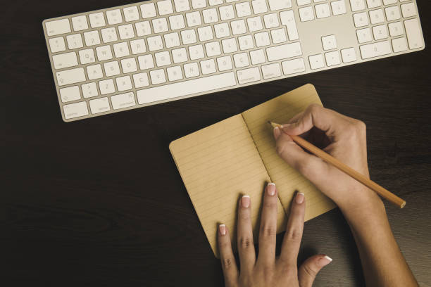 Businesswomen  brainstorming and writing notes