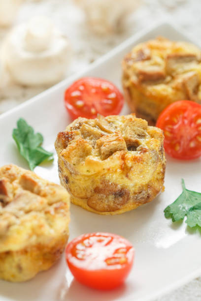 istock Omelette with mushrooms, parsley, cherry tomatoes and bread croutons.  Scrambled eggs. Tortilla. Frittata. Traditional tasty Breakfast. Brunch 1097052256