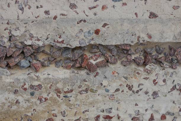 gray concrete stone wall background with brown rubble
