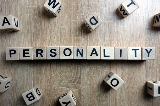 Personality word from wooden blocks on desk