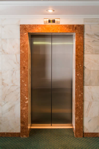 istock Metal Elevator doors in the lobby. Corridor in a hotel 1097060806