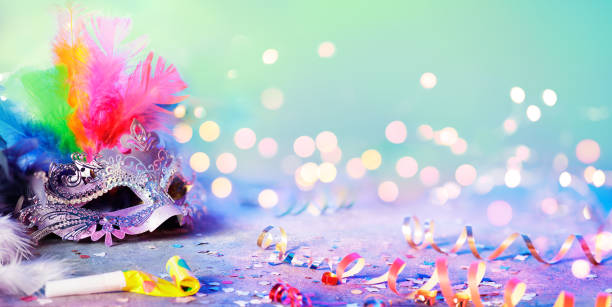istock Carnival Mask With Defocused Streamer Party Confetti And Bokeh 1097061522