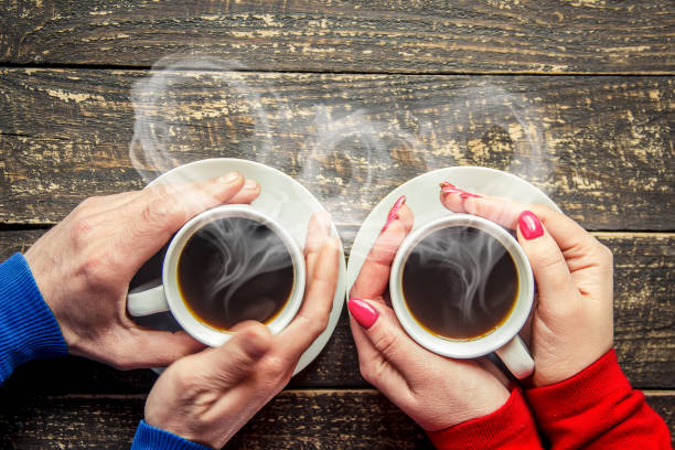 Cup drink for Breakfast in the hands of lovers. Selective focus.