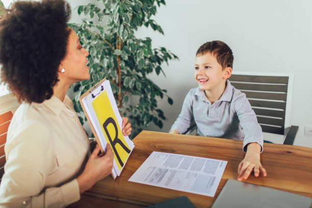 istock Shot of a speech therapist during a session with a little boy 1097063594