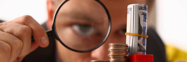 istock Businessman holds in hand black lens 1097070090