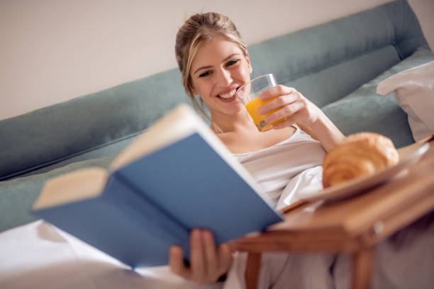 istock Beautiful woman having breakfast in bed 1097071956