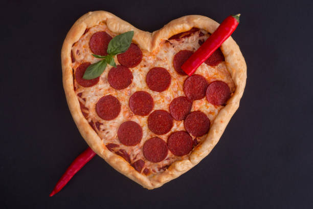 istock Pizza heart shaped with pepperoni 1097077582
