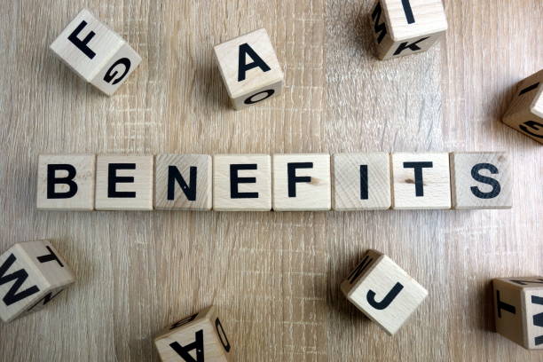 Benefits word from wooden blocks Benefits word from wooden blocks on desk charity benefit stock pictures, royalty-free photos & images