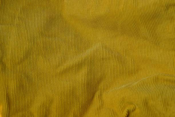 istock yellow fabric texture from a crumpled piece of cloth on clothes 1097083062