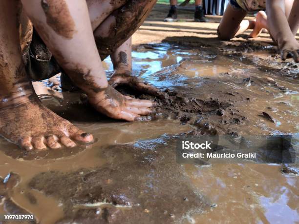 Playing In The Mud Stock Photo - Download Image Now - Mud, Child, Playing