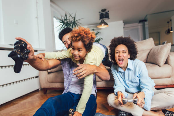 istock Family Playing Video Games Together 1097088058