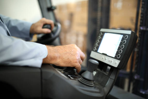 Driving Forklift Driving new electric forklift at factory video game truck stock pictures, royalty-free photos & images