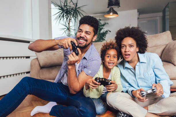 istock Family Playing Video Games Together 1097093228
