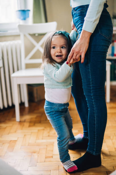 istock Mother and daughter having fun at home 1097093652