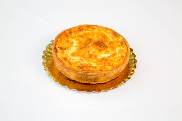 istock quiche on a gold tray with white background 1097095248