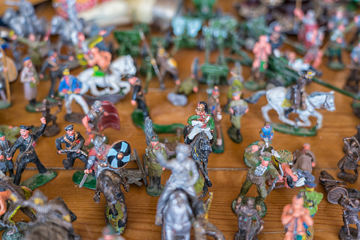 Large group of toy soldiers made of lead. Close up, selective focus.