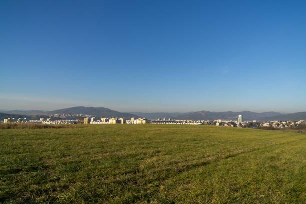 istock Green meadow during sunny and cloudy afternoon. 1097099514