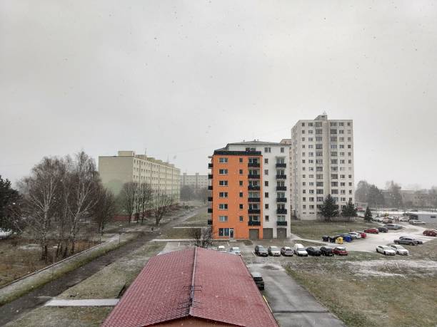 istock Roofs of buildings covered by snow during strong snowfall. 1097099676