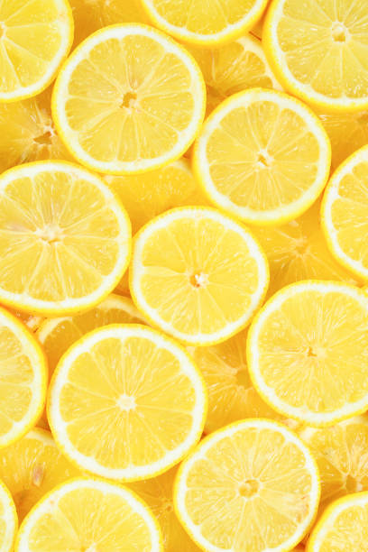 istock A slices of fresh juicy yellow lemons.  Texture background, pattern. 1097099950