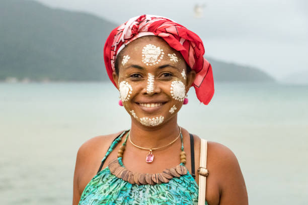 Portrait of a Malagasy woman with her face painted, Vezo-Sakalava tradition, Nosy Be, Madagascar. stock photo