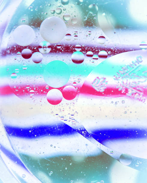 istock Oil drops on a water surface with colourful background 1097102612