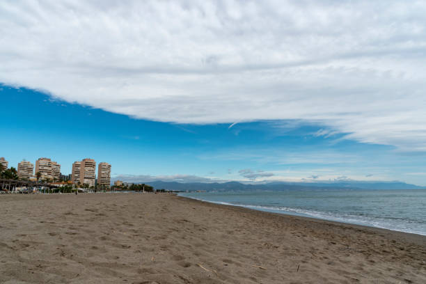 Clouds at Torremolinos in Spain Clouds at Torremolinos in Spain torremolinos beach stock pictures, royalty-free photos & images
