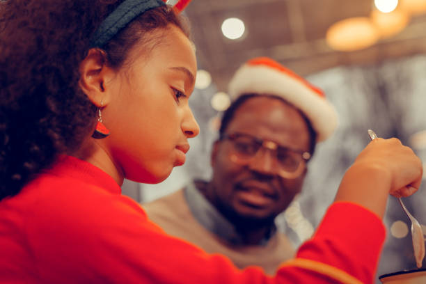 istock Close up of appealing daughter drinking cocoa with her dad 1097113612
