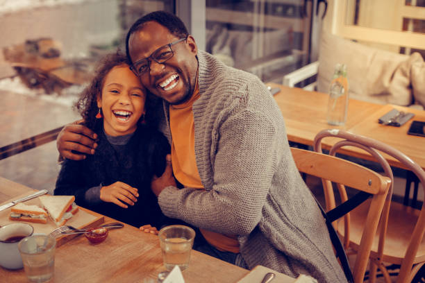 istock Father and daughter laughing out loud while spending time together 1097113824