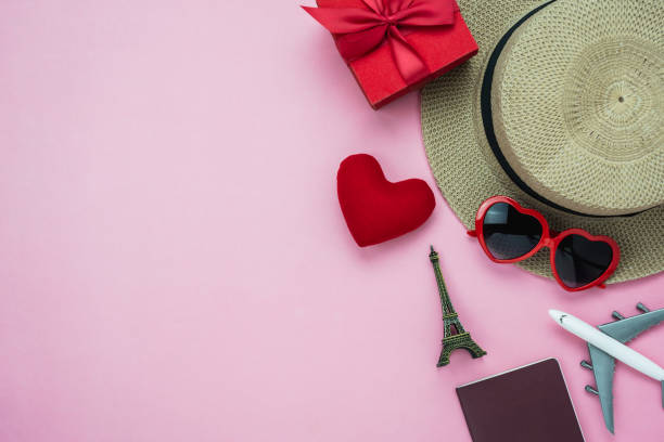 istock Table top view aerial image of decorations valentine's day background concept.Flat lay essential items clothing women & cosmetic for travel Paris France.Heart shape with gift box with garment on paper 1097126464