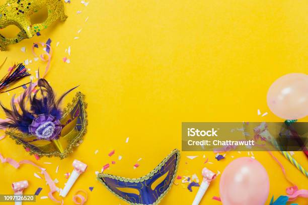 Table Top View Aerial Image Of Beautiful Colorful Decorations Carnival Festival Backgroundflat Lay Accessory Object The Mask Decor Confetti And Pink Balloon On Modern Yellow Papercopy Space Stock Photo - Download Image Now
